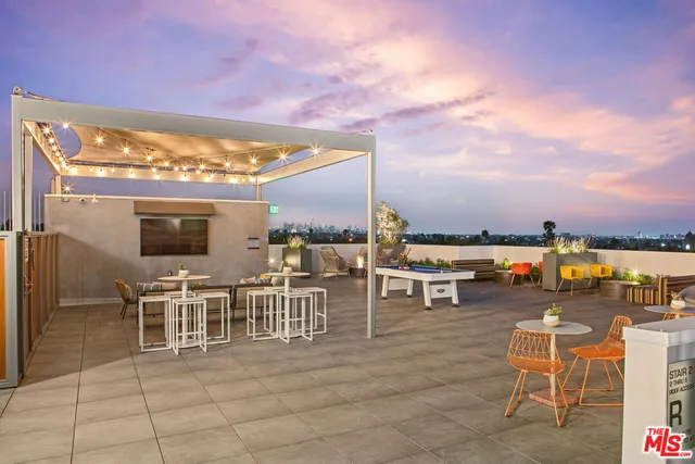 a view of a terrace with furniture