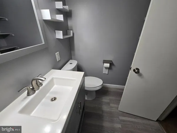 a bathroom with a sink and toilet