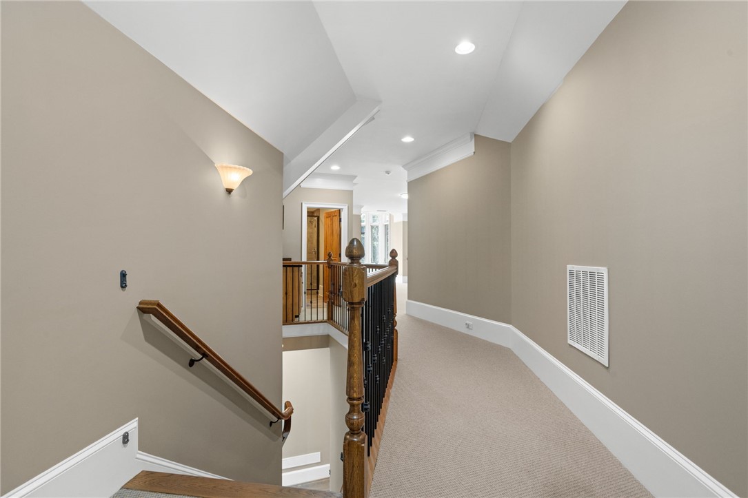 314 Palmer Way Sunset, SC 29685 - Photo 20 of 48 A well-lit landing with recessed lighting, offering a clear view down the elegant wooden staircase.