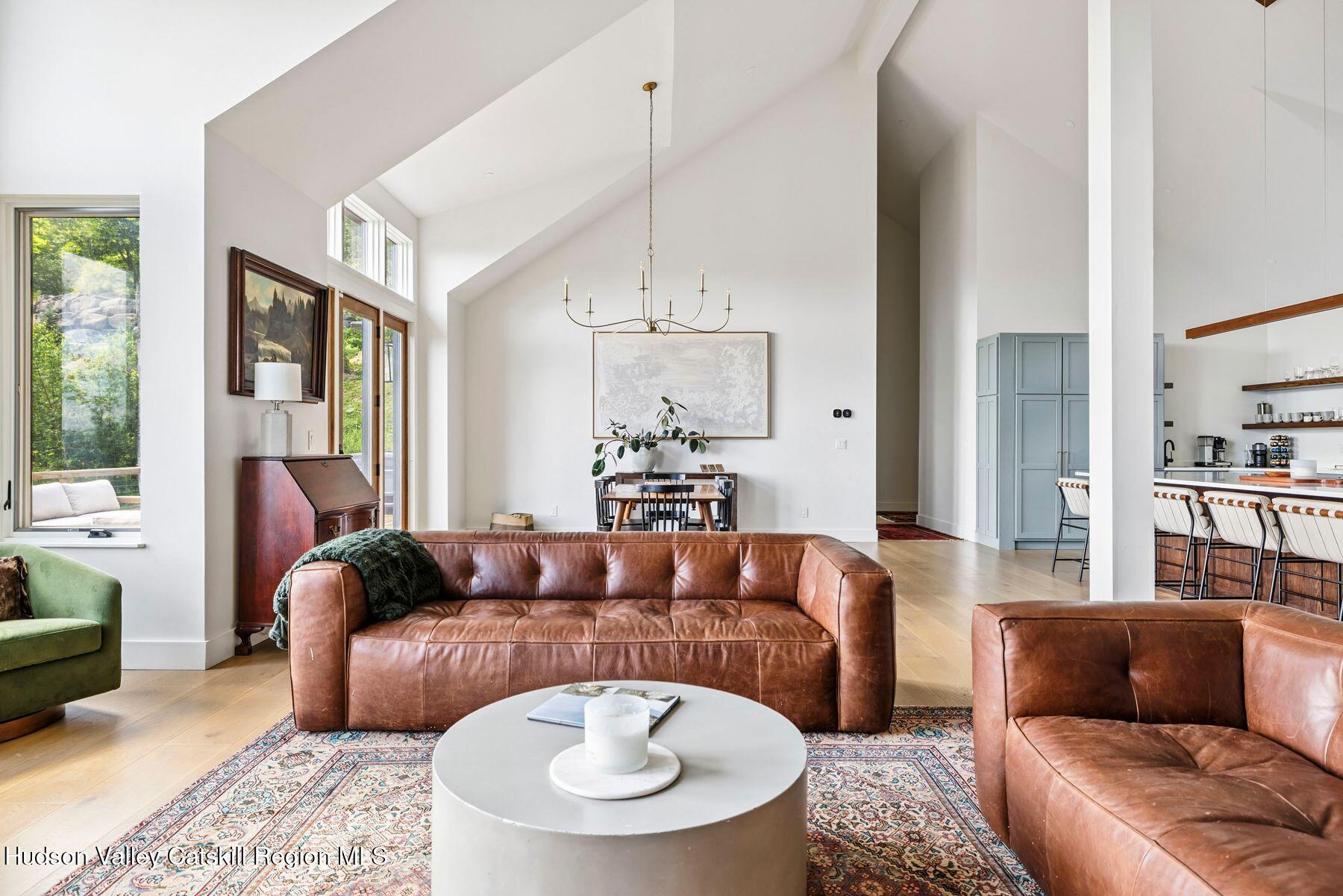 219 Club Road Windham, NY 12496 - Photo 11 of 103 a living room with furniture and a large window