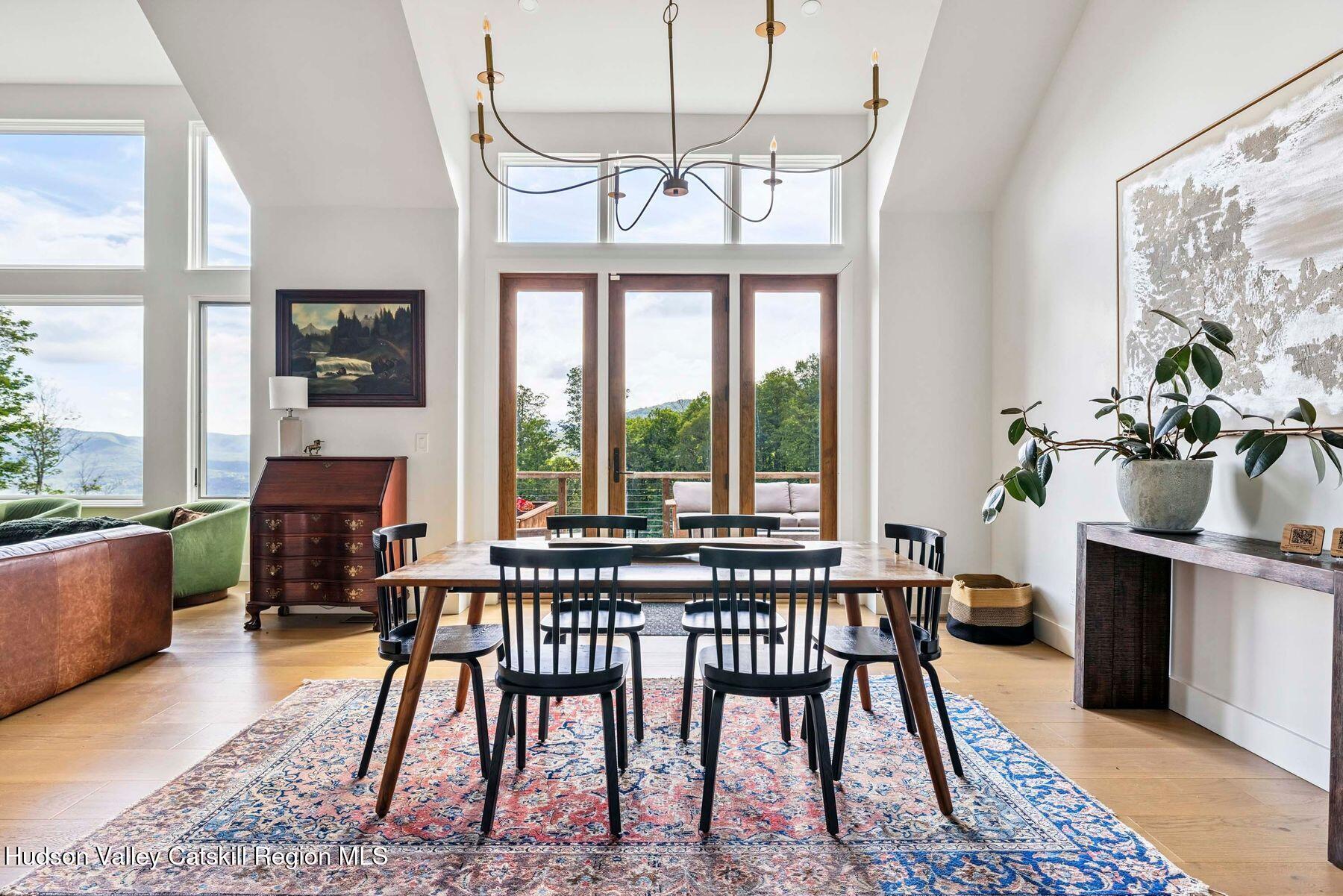 219 Club Road Windham, NY 12496 - Photo 14 of 103 a view of a dining room with furniture window and outside view