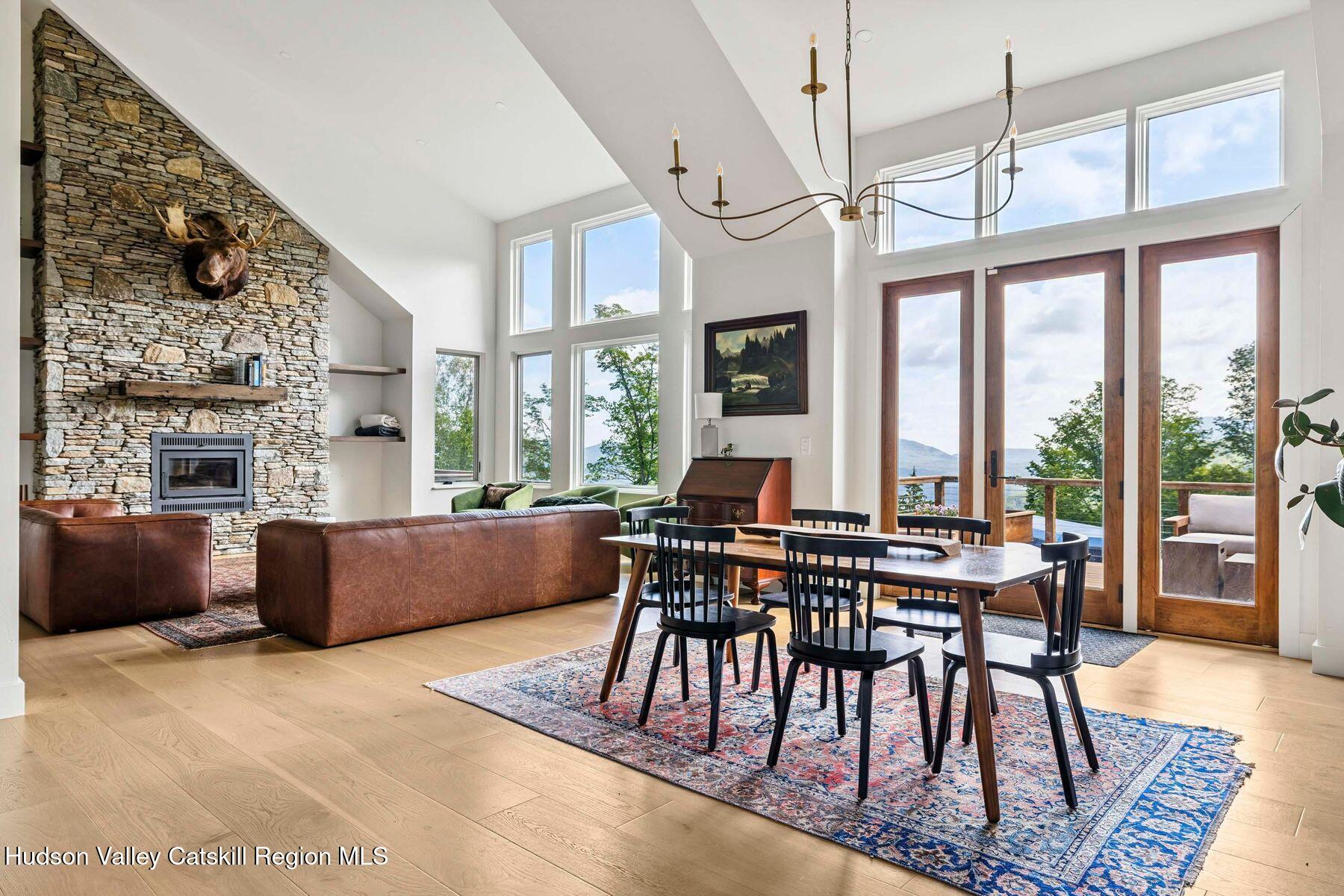 219 Club Road Windham, NY 12496 - Photo 15 of 103 a view of a dining room with furniture window and wooden floor