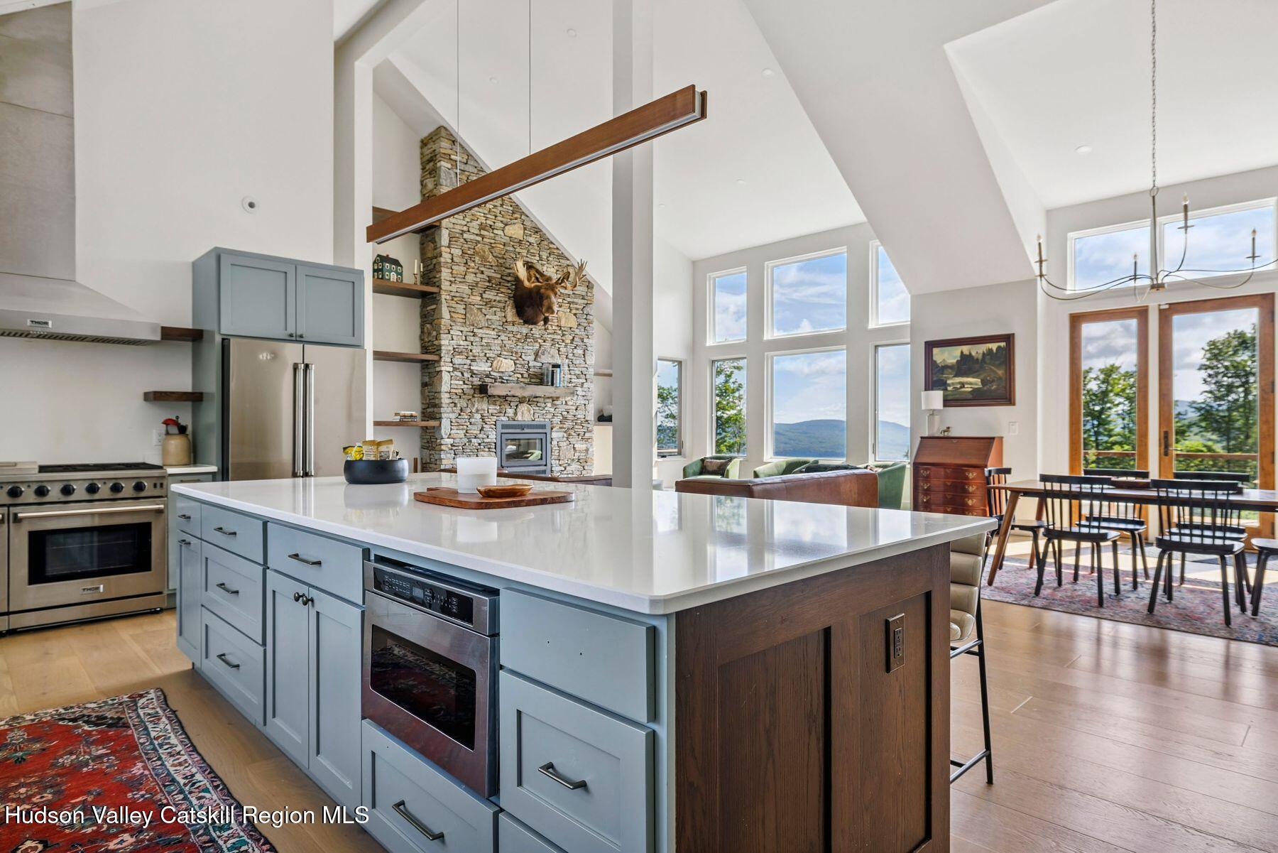 219 Club Road Windham, NY 12496 - Photo 18 of 103 a kitchen with stainless steel appliances granite countertop a stove and a sink