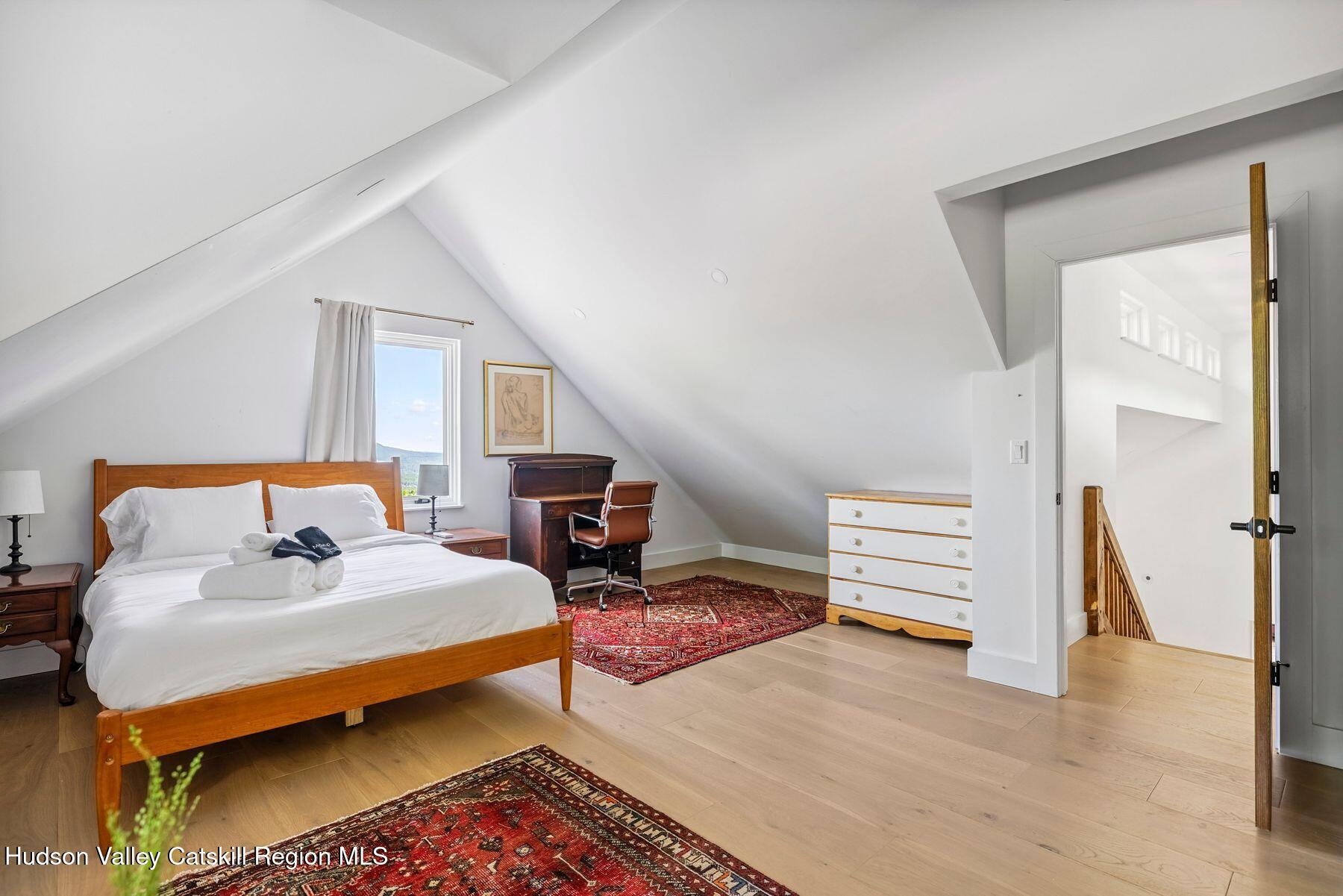 219 Club Road Windham, NY 12496 - Photo 26 of 103 a bedroom with furniture and a window