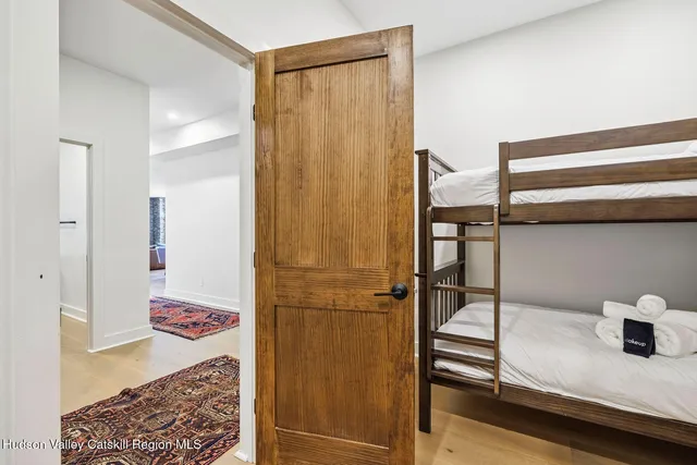 a living room with furniture and large windows