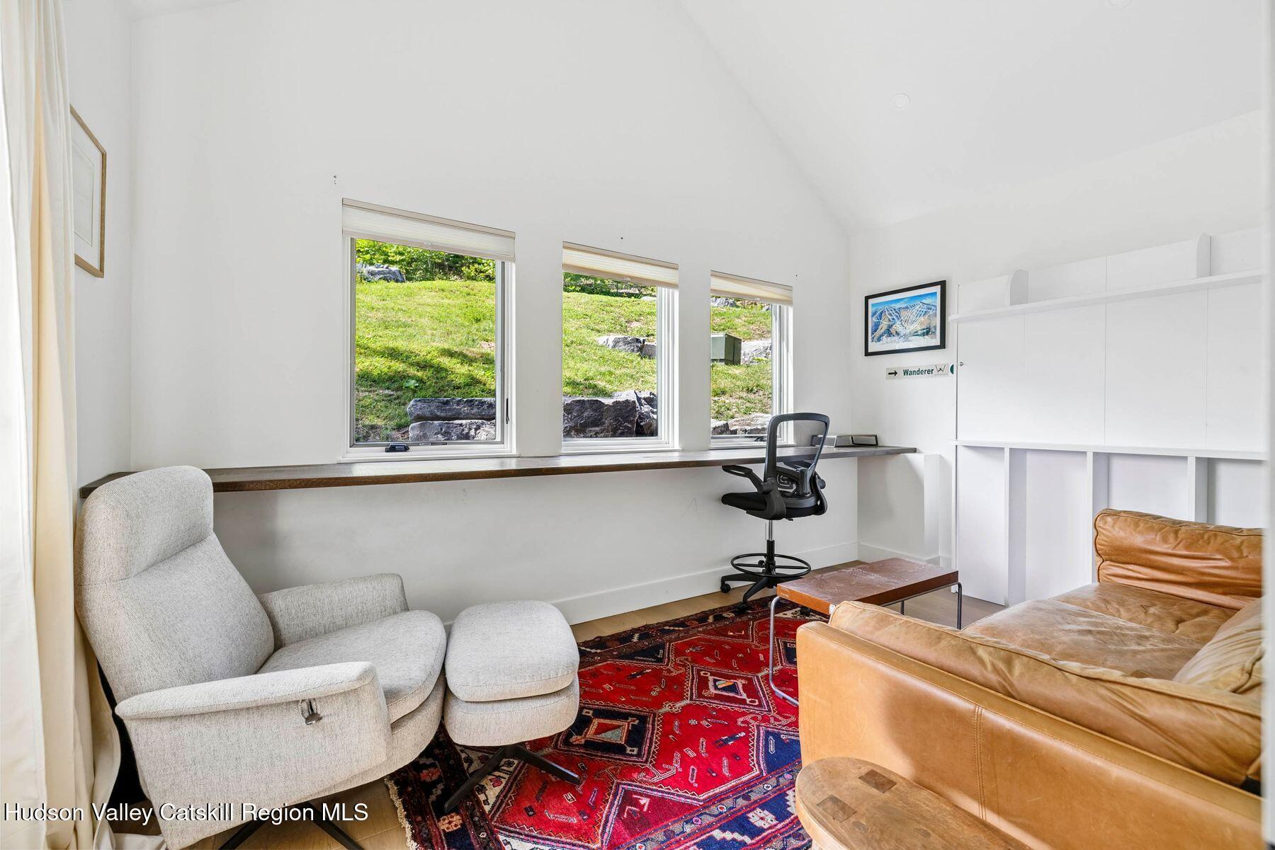 219 Club Road Windham, NY 12496 - Photo 44 of 103 a work room with furniture and a window