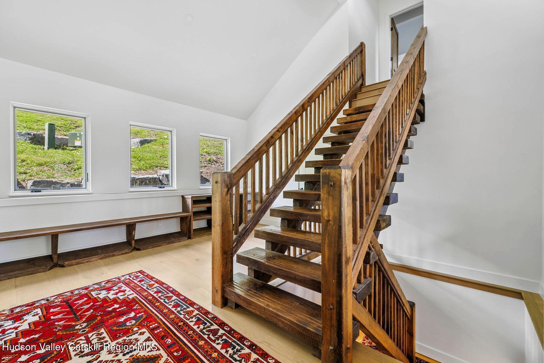 219 Club Road Windham, NY 12496 - Photo 49 of 103 a view of an empty room with wooden floor and windows