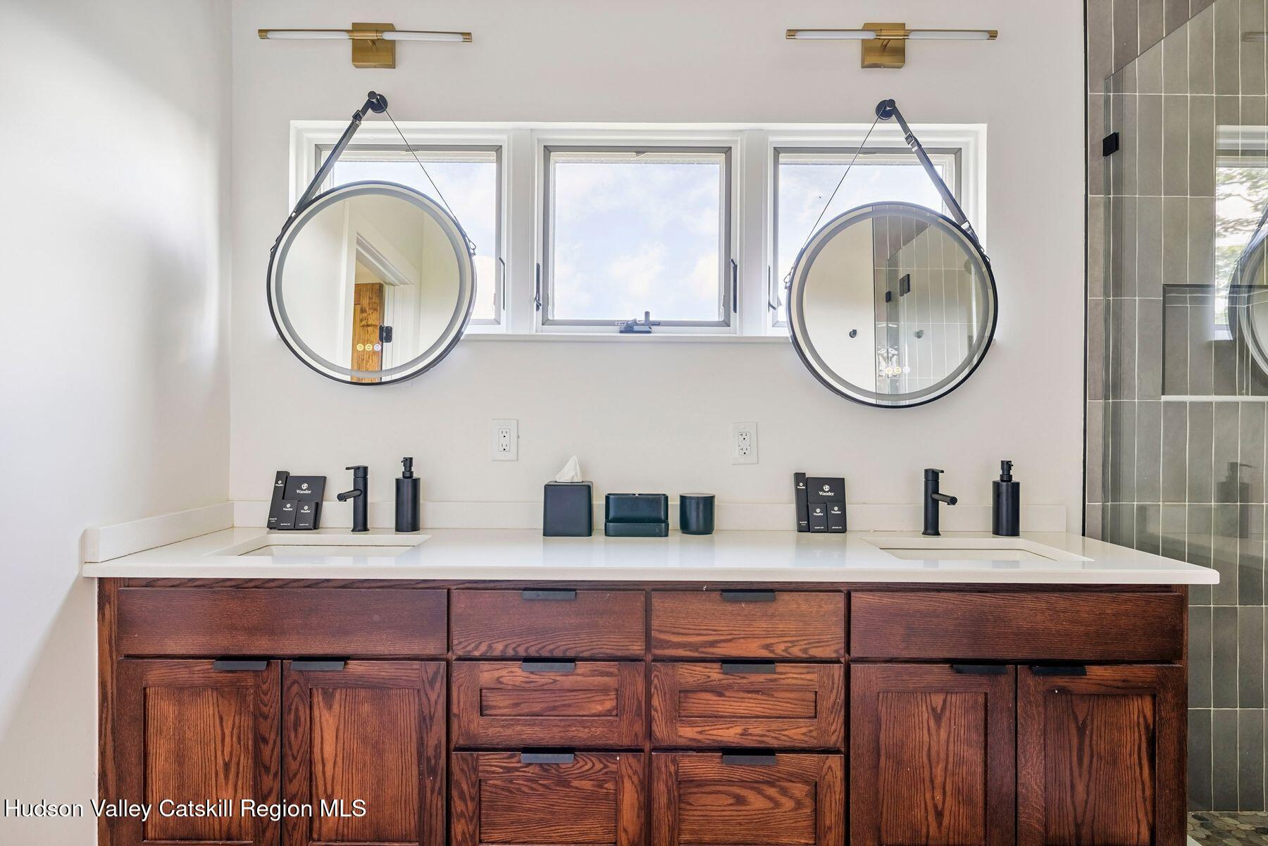 219 Club Road Windham, NY 12496 - Photo 57 of 103 a bathroom with a sink and a mirror