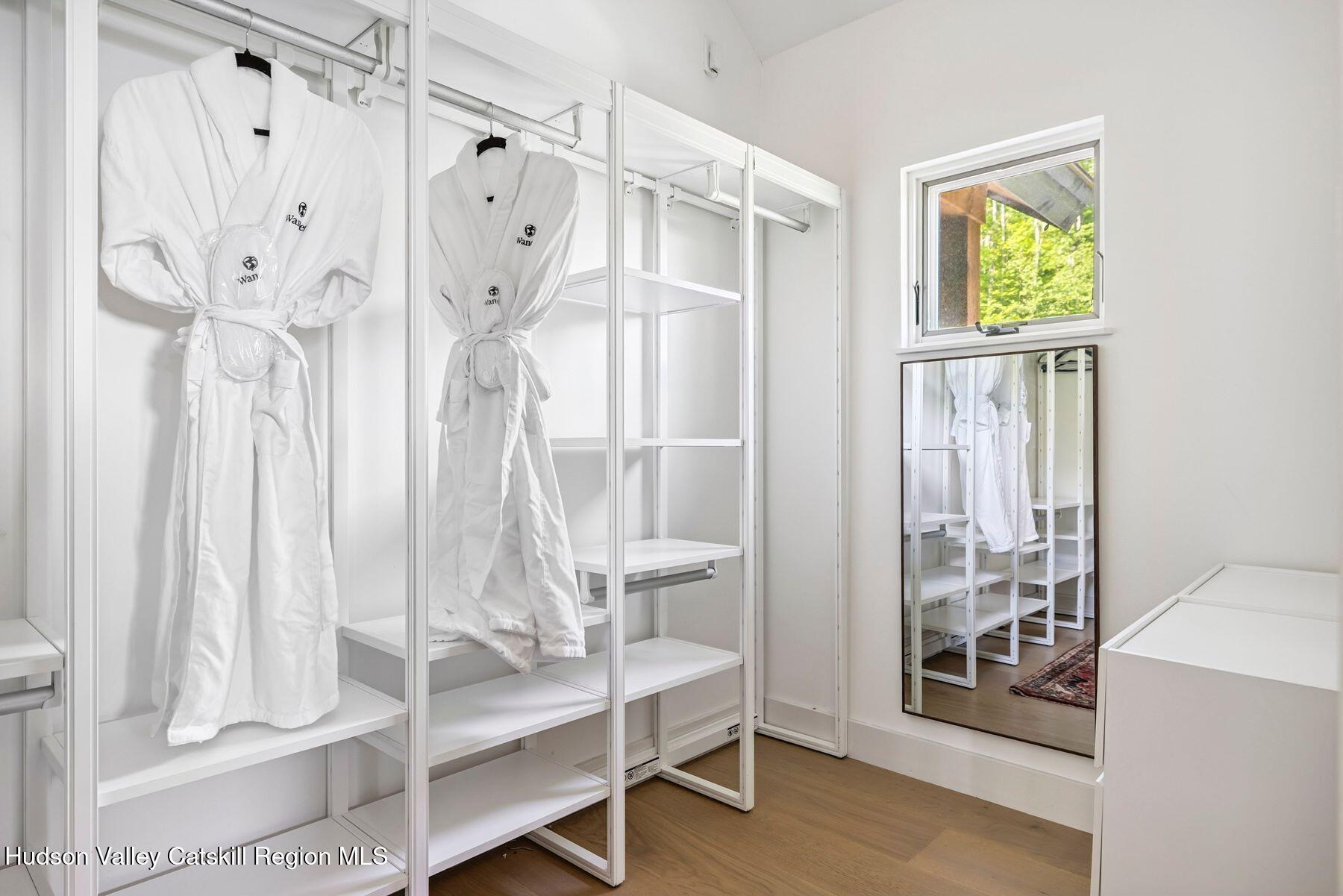 219 Club Road Windham, NY 12496 - Photo 60 of 103 a view of an empty room with wooden floor and a window