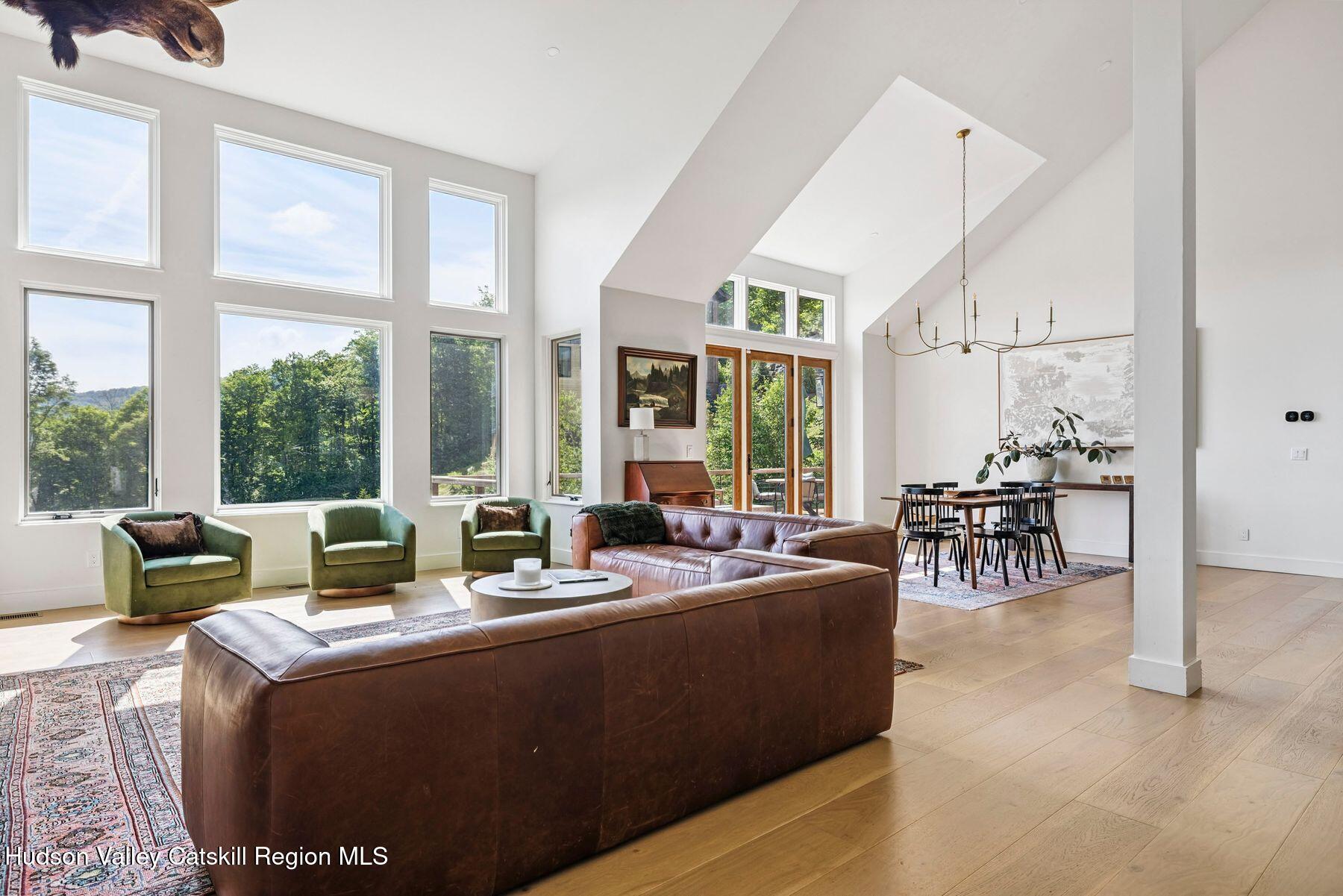219 Club Road Windham, NY 12496 - Photo 6 of 103 a living room with fireplace furniture and a large window