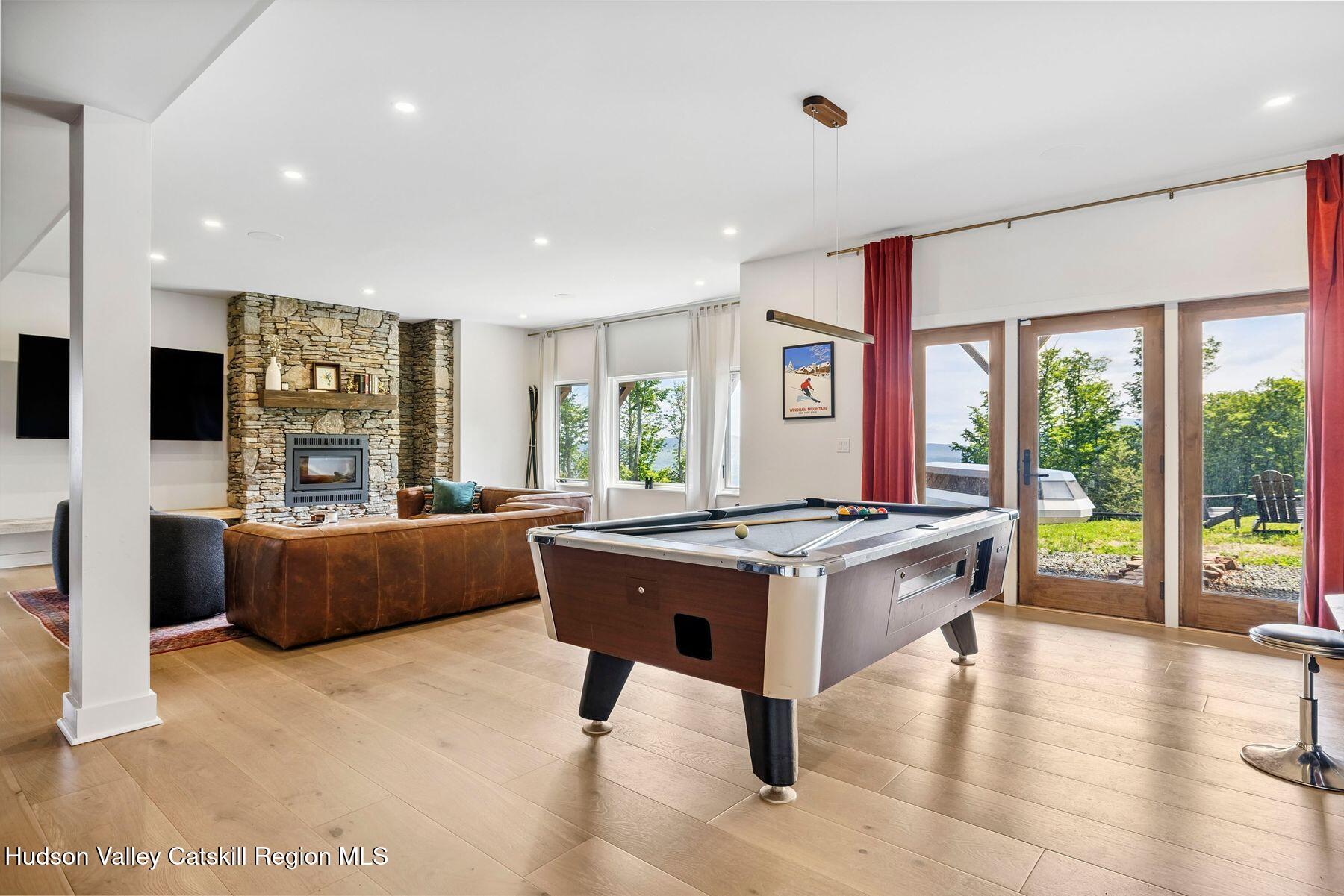 219 Club Road Windham, NY 12496 - Photo 65 of 103 a living room with furniture and a large window