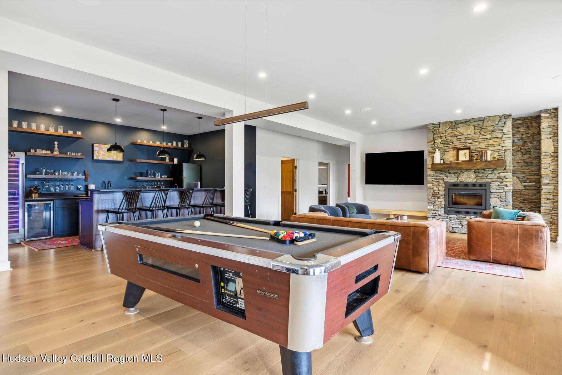219 Club Road Windham, NY 12496 - Photo 66 of 103 a kitchen with stainless steel appliances granite countertop a stove and a refrigerator