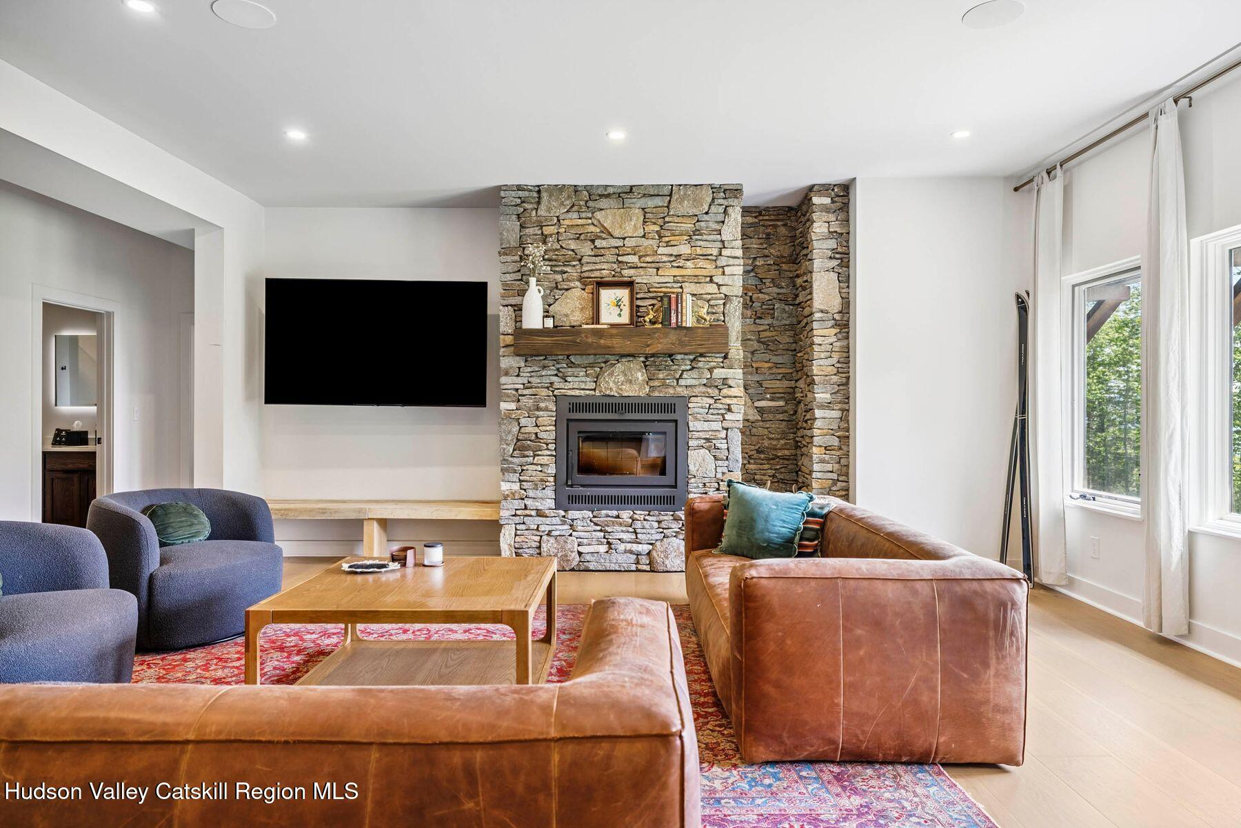 219 Club Road Windham, NY 12496 - Photo 67 of 103 a living room with furniture fireplace and flat screen tv