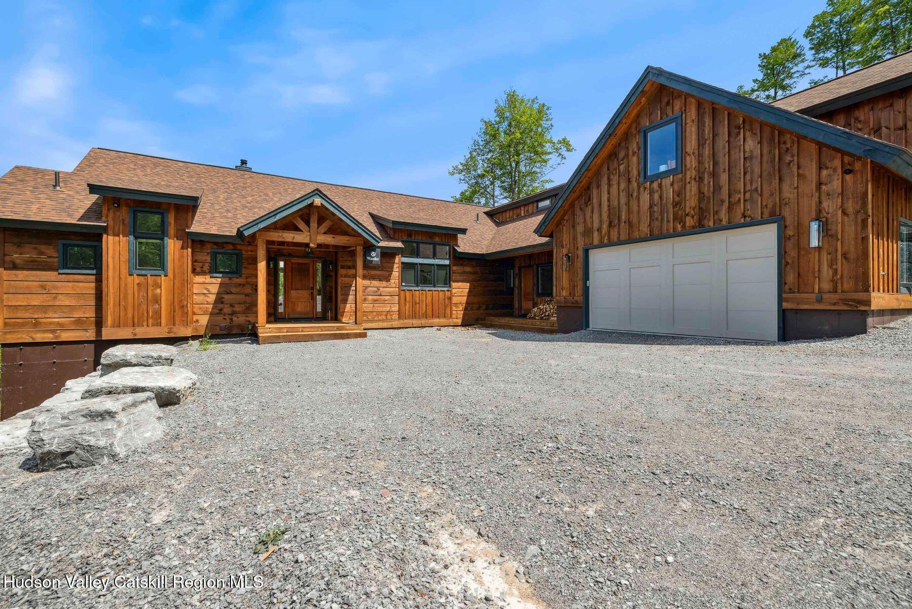 219 Club Road Windham, NY 12496 - Photo 91 of 103 a front view of a house with a yard