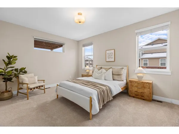 a spacious bedroom with a bed and a table