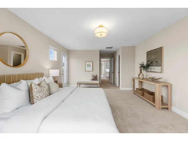 a bedroom with a bed and a television