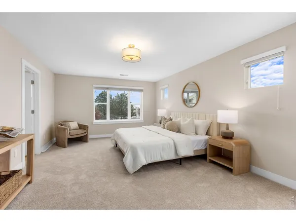 a bedroom with bed and window