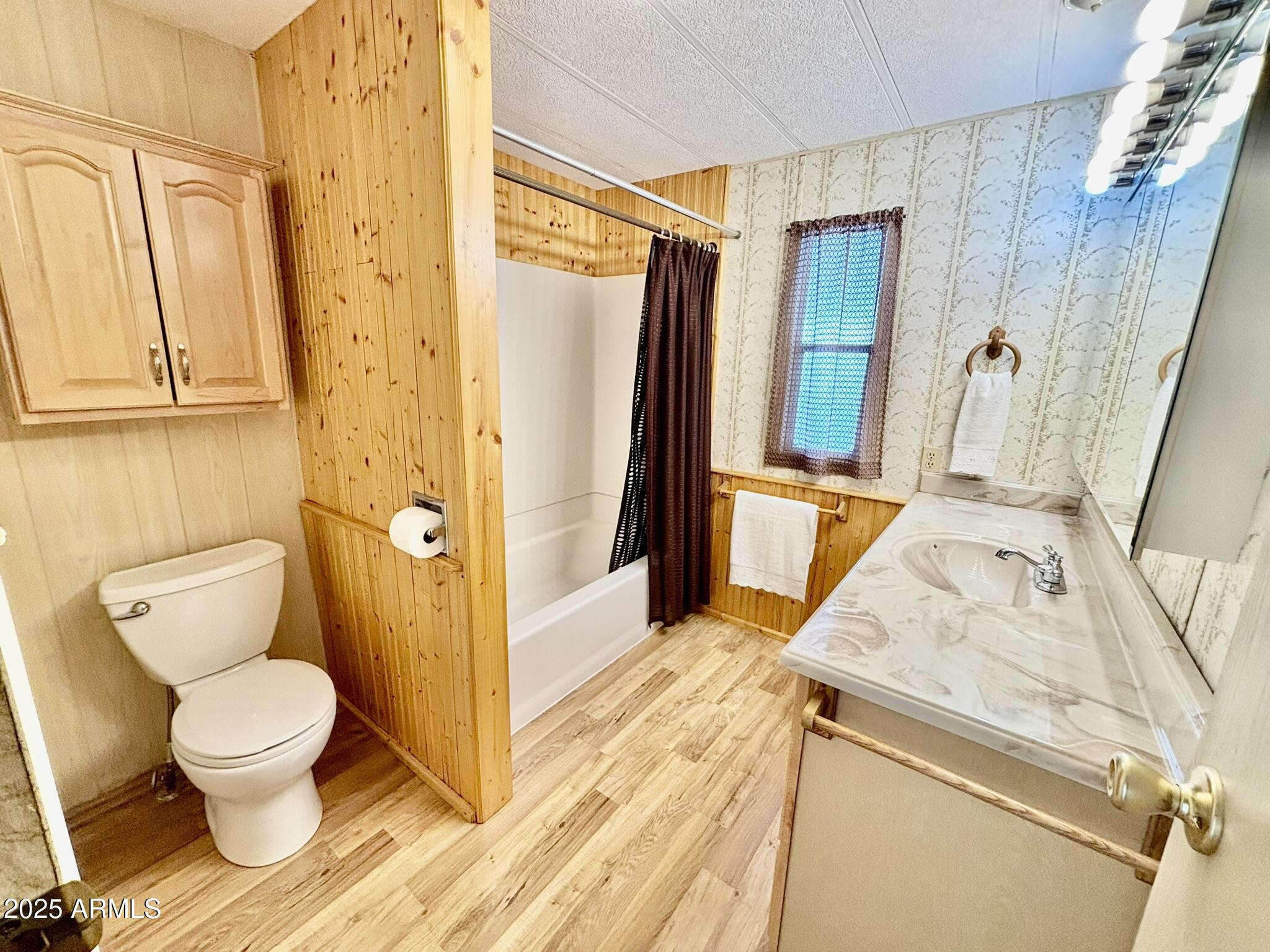 1050 East Broadway Avenue, Unit 44 Apache Junction, AZ 85119 - Photo 14 of 40 a bathroom with a sink a toilet and shower