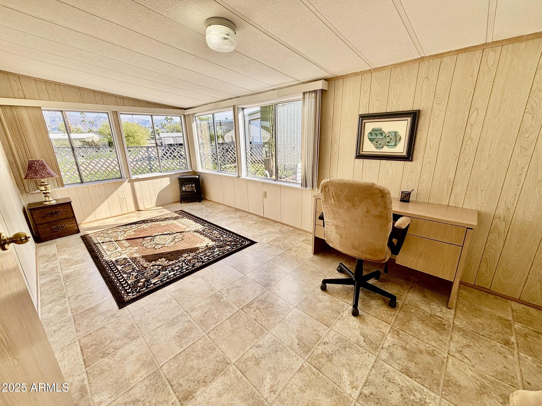 1050 East Broadway Avenue, Unit 44 Apache Junction, AZ 85119 - Photo 16 of 40 a living room with furniture rug and a table