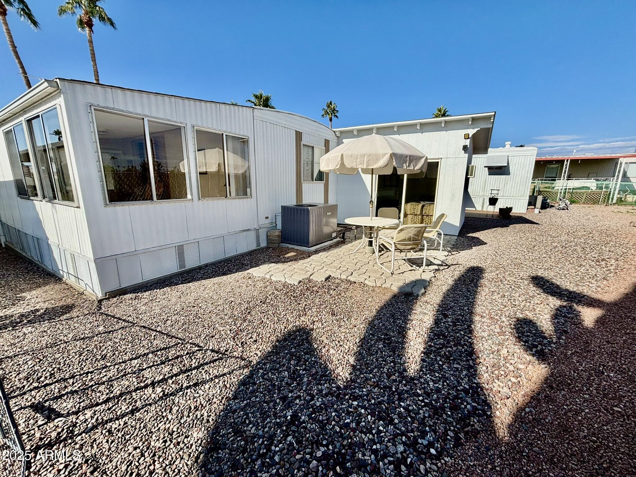 1050 East Broadway Avenue, Unit 44 Apache Junction, AZ 85119 - Photo 24 of 40 a view of swimming pool with sitting area
