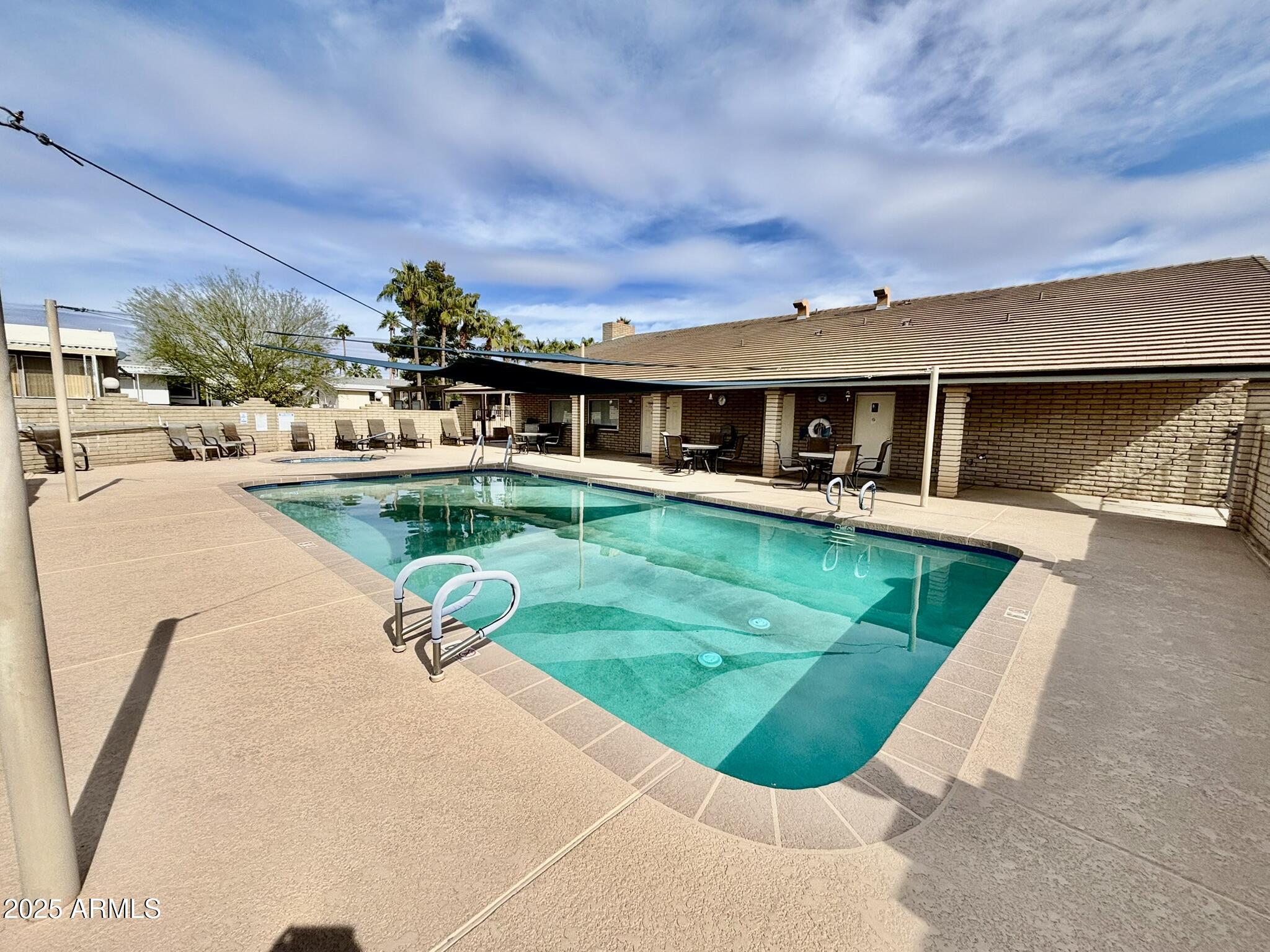1050 East Broadway Avenue, Unit 44 Apache Junction, AZ 85119 - Photo 39 of 40 a view of a house with a backyard porch and sitting area