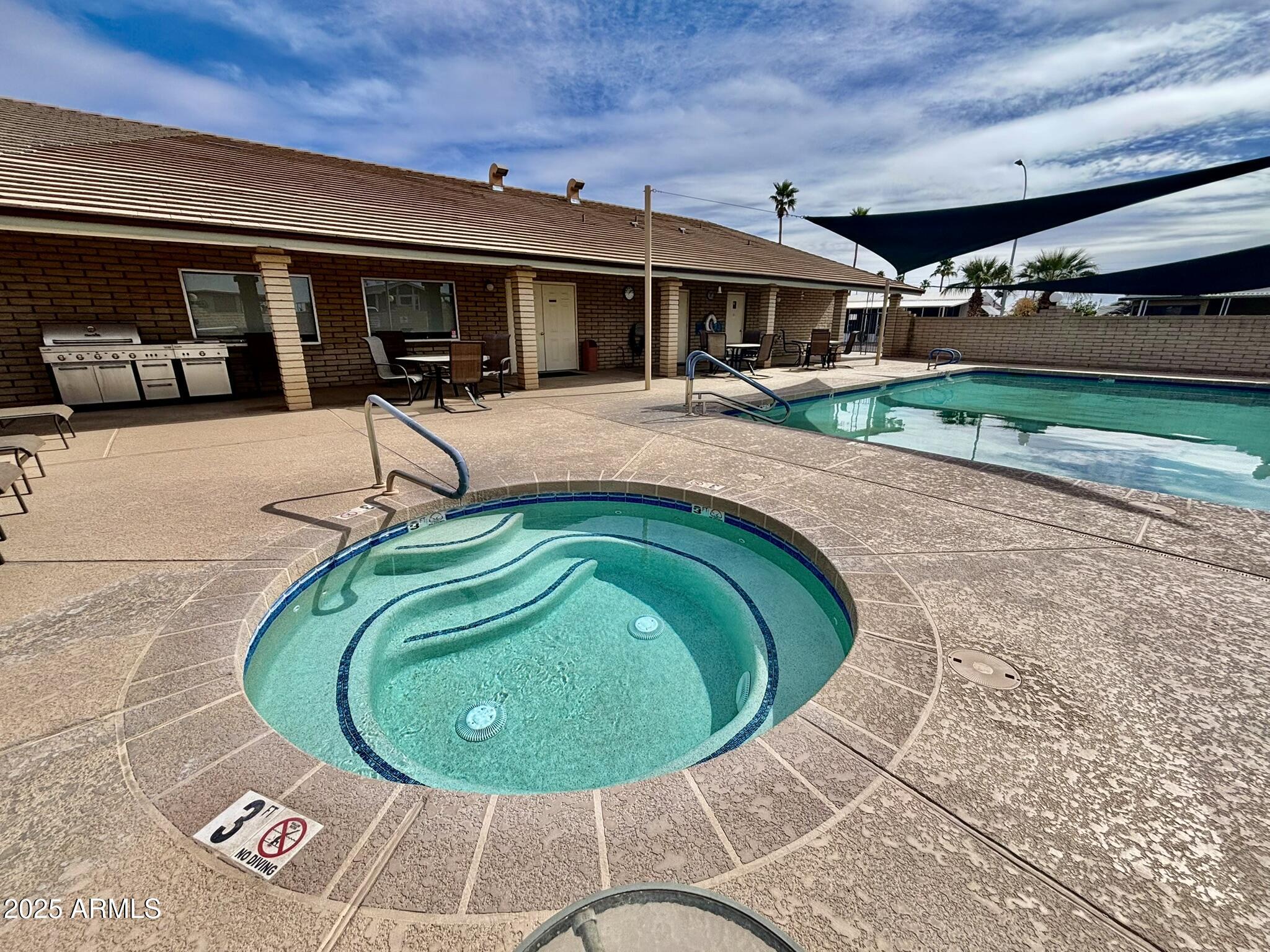 1050 East Broadway Avenue, Unit 44 Apache Junction, AZ 85119 - Photo 40 of 40 a view of a swimming pool with a patio