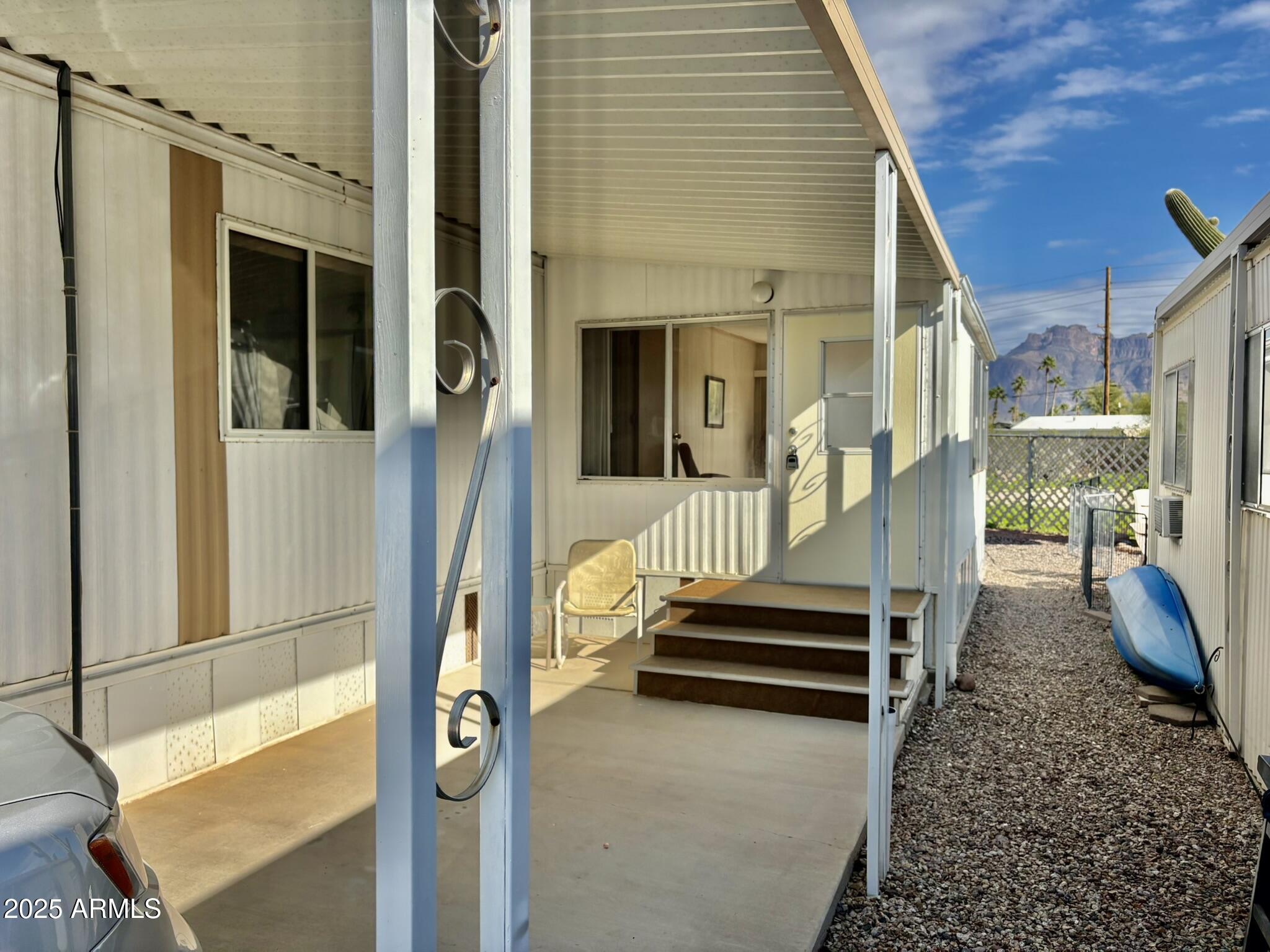 1050 East Broadway Avenue, Unit 44 Apache Junction, AZ 85119 - Photo 5 of 40 a front view of a house with a porch