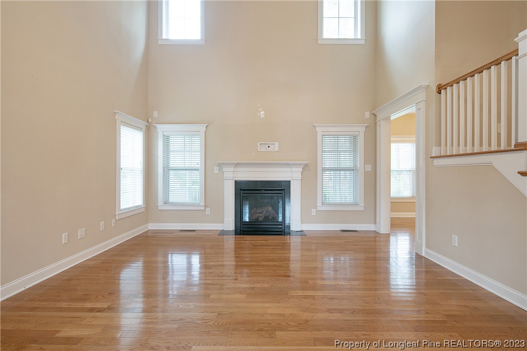 32 Shellnut Circle Spring Lake, NC 28390 - Photo 14 of 50 a view of a livingroom with wooden floor and a fireplace