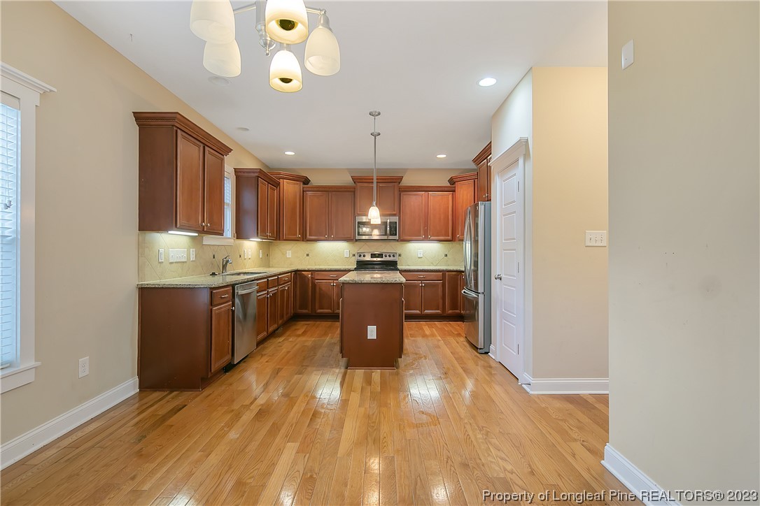 32 Shellnut Circle Spring Lake, NC 28390 - Photo 15 of 50 a large kitchen with a lot of counter space and stainless steel appliances