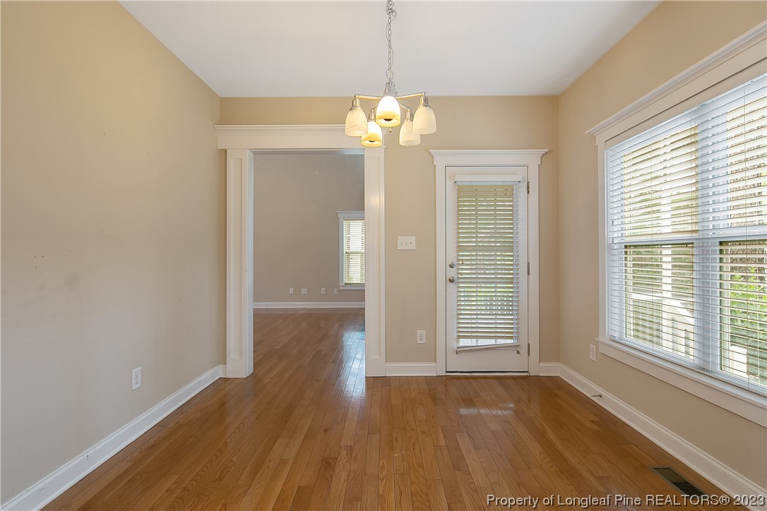32 Shellnut Circle Spring Lake, NC 28390 - Photo 18 of 50 a view of an empty room with wooden floor and a window