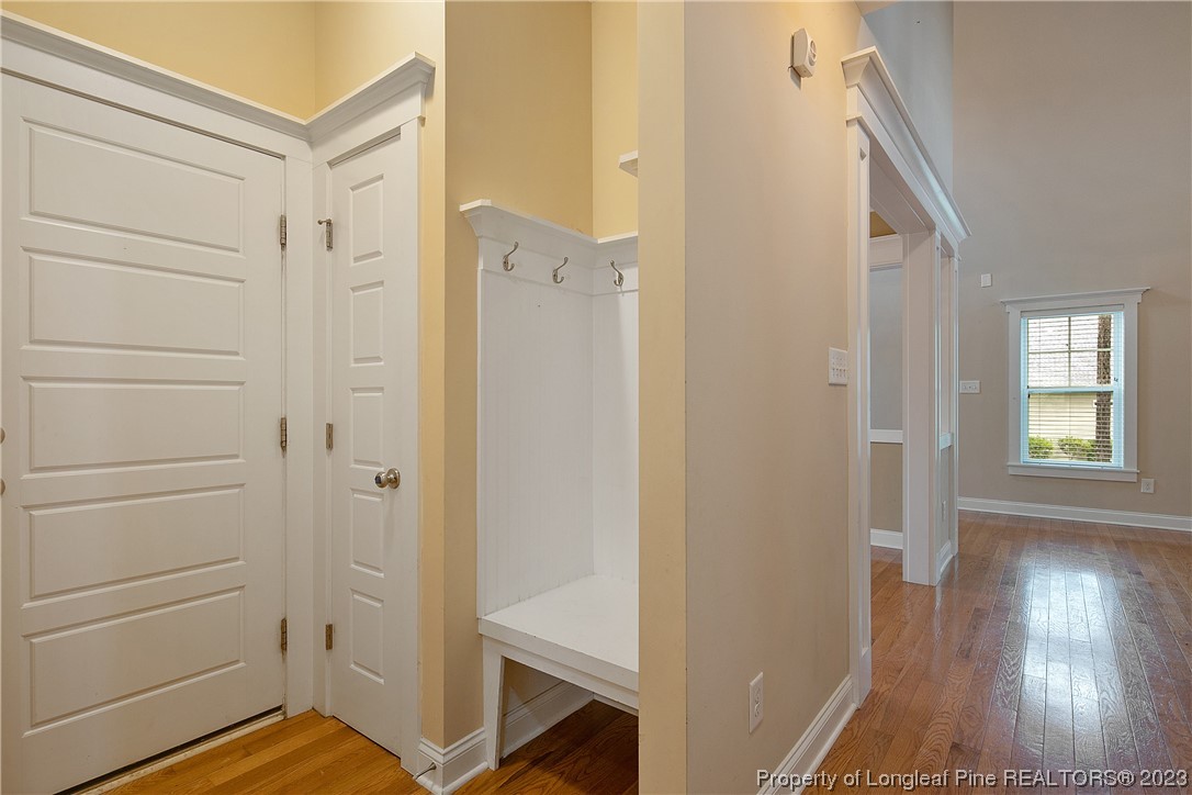32 Shellnut Circle Spring Lake, NC 28390 - Photo 26 of 50 a view of a hallway with wooden floor and staircase
