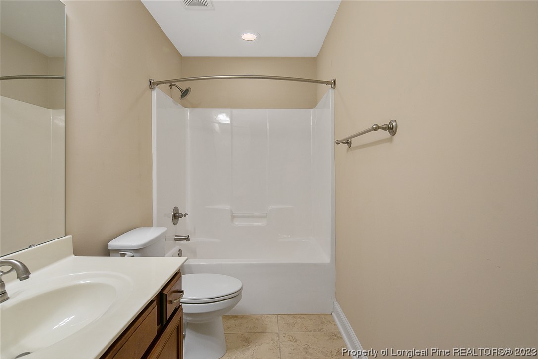 32 Shellnut Circle Spring Lake, NC 28390 - Photo 42 of 50 a bathroom with a sink toilet and shower
