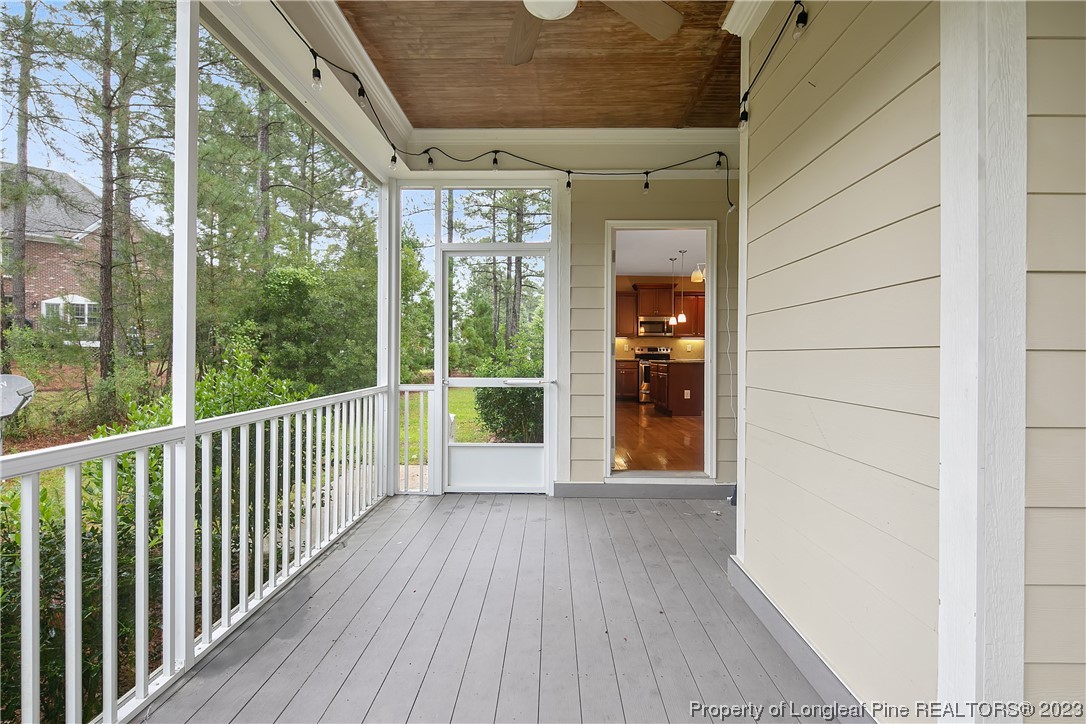 32 Shellnut Circle Spring Lake, NC 28390 - Photo 48 of 50 a view of porch with wooden floor and floor to ceiling window