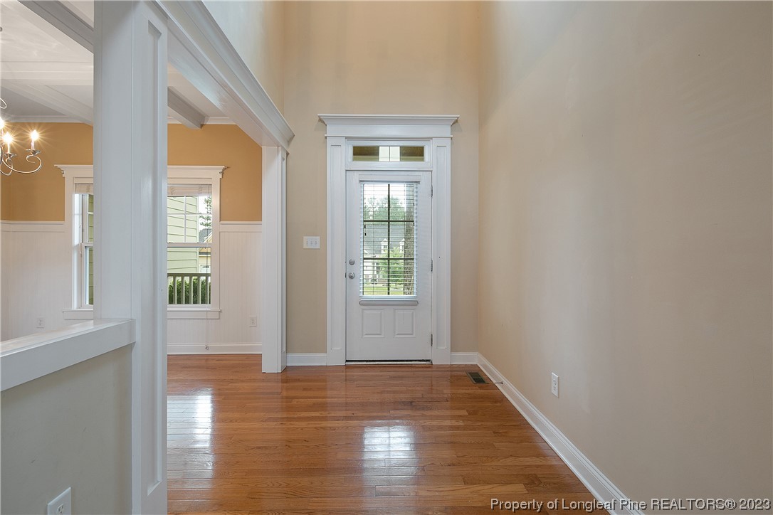 32 Shellnut Circle Spring Lake, NC 28390 - Photo 6 of 50 a view of an empty room with wooden floor and a window