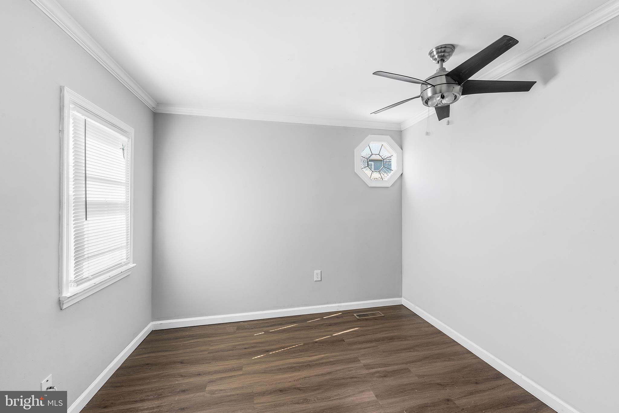 2 Fusting Avenue Baltimore, MD 21228 - Photo 12 of 26 an empty room with wooden floor closet and windows