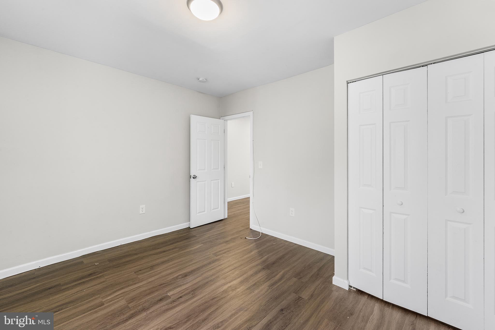 2 Fusting Avenue Baltimore, MD 21228 - Photo 19 of 26 a view of an empty room with wooden floor
