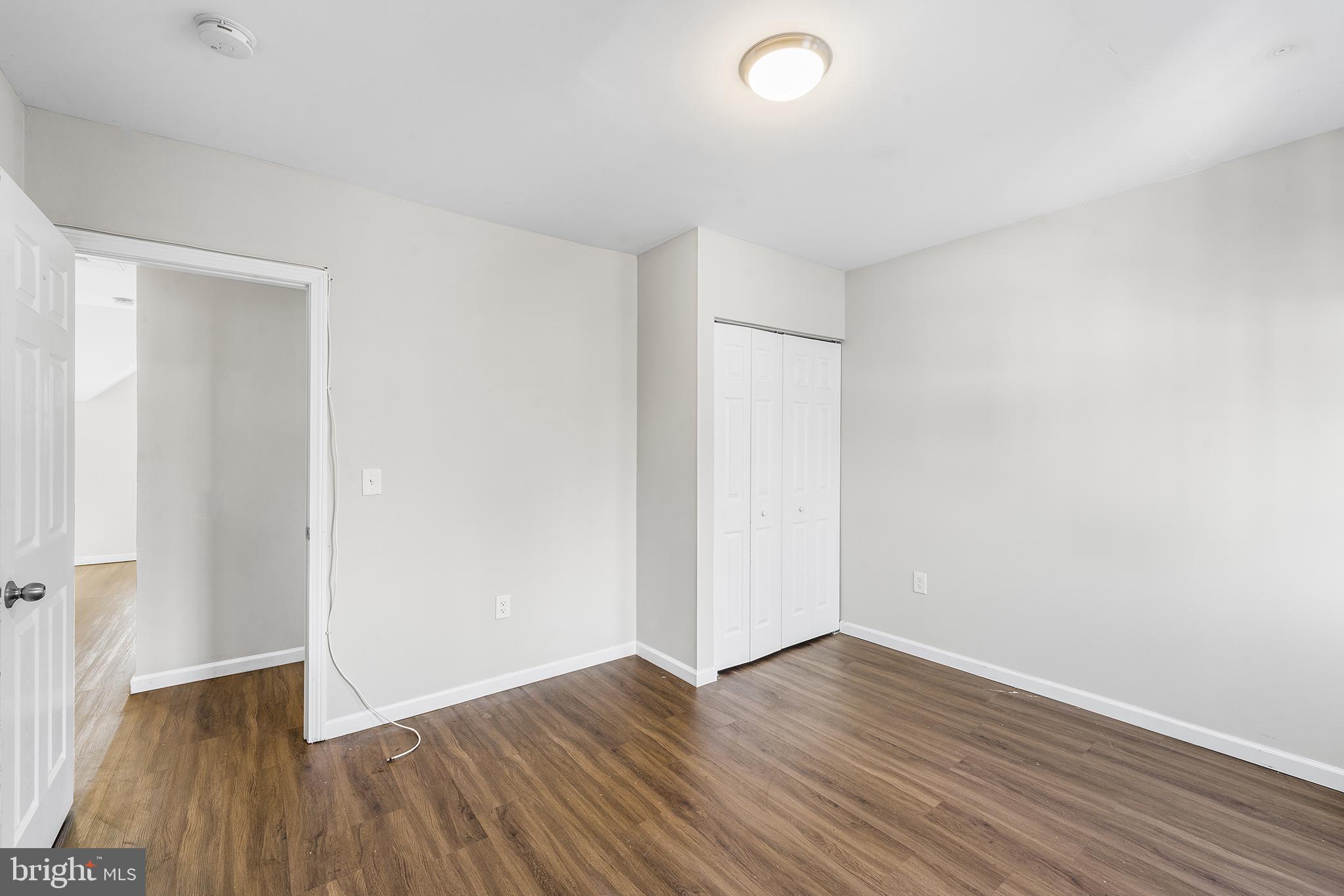 2 Fusting Avenue Baltimore, MD 21228 - Photo 20 of 26 a view of an empty room with wooden floor