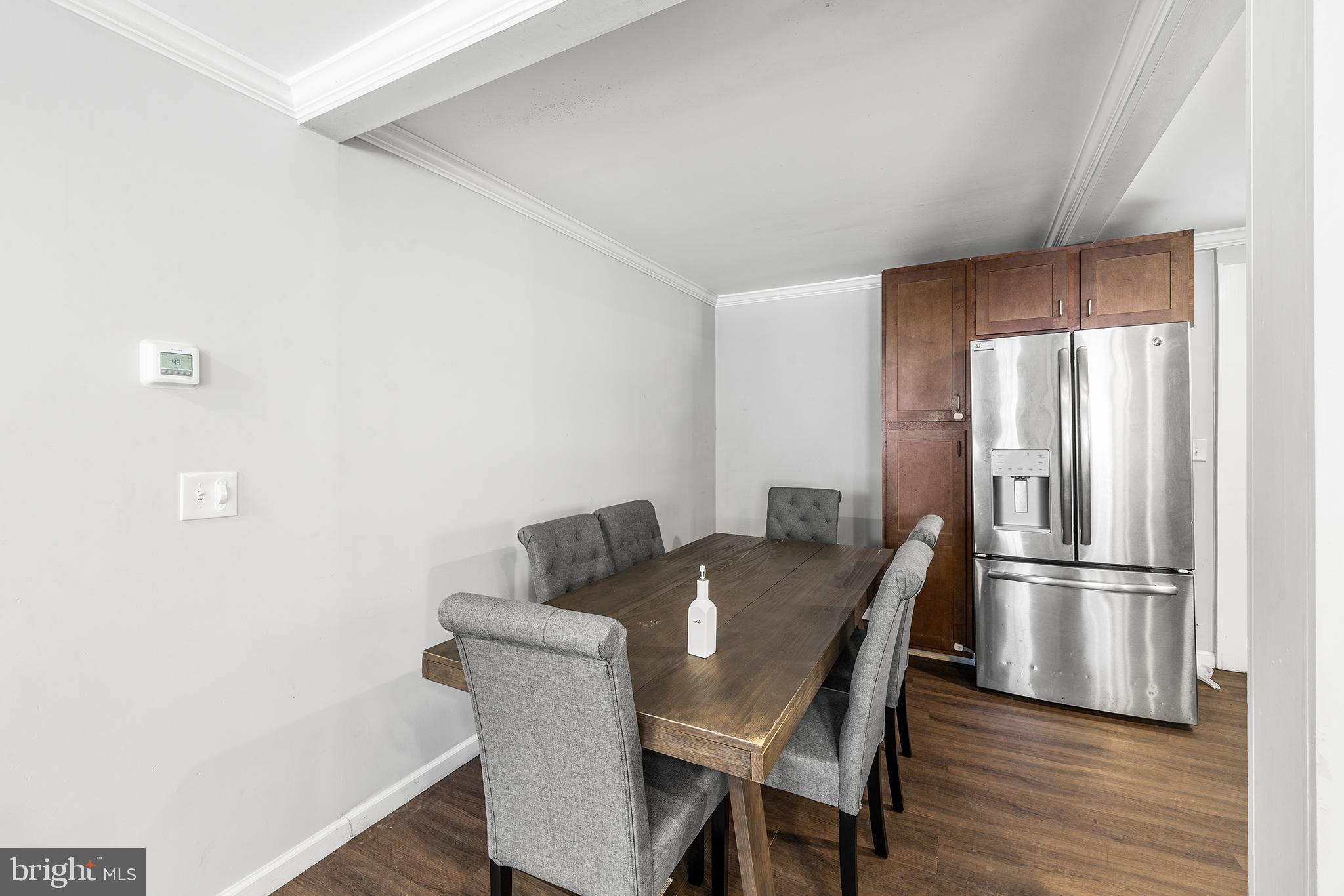 2 Fusting Avenue Baltimore, MD 21228 - Photo 9 of 26 a view of a dining room with furniture wooden floor and kitchen