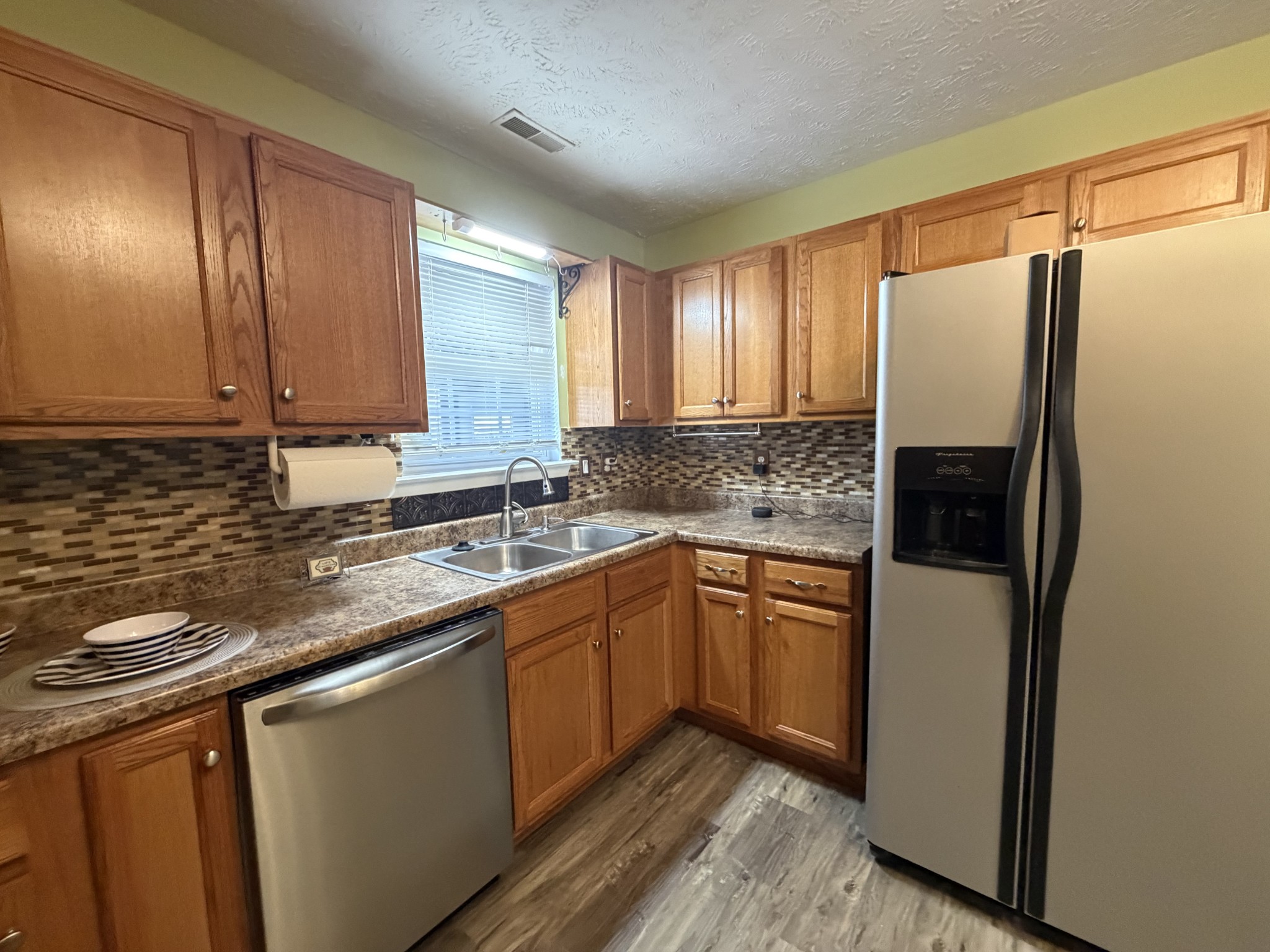 2938 Ridgewood Drive Christiana, TN 37037 - Photo 18 of 66 a kitchen with stainless steel appliances granite countertop a refrigerator and a sink