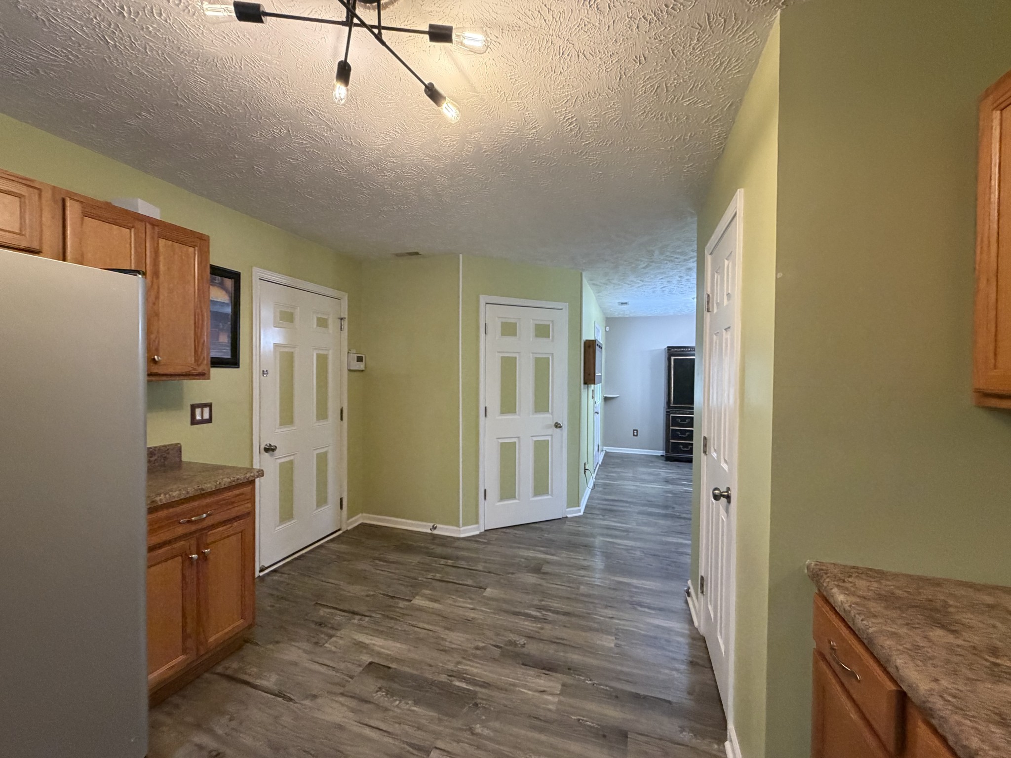 2938 Ridgewood Drive Christiana, TN 37037 - Photo 22 of 66 a view of a kitchen with refrigerator and wooden floor