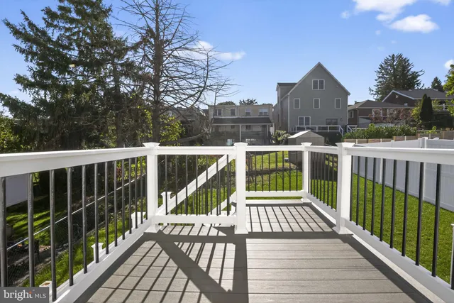 a view of a balcony with wooden floor