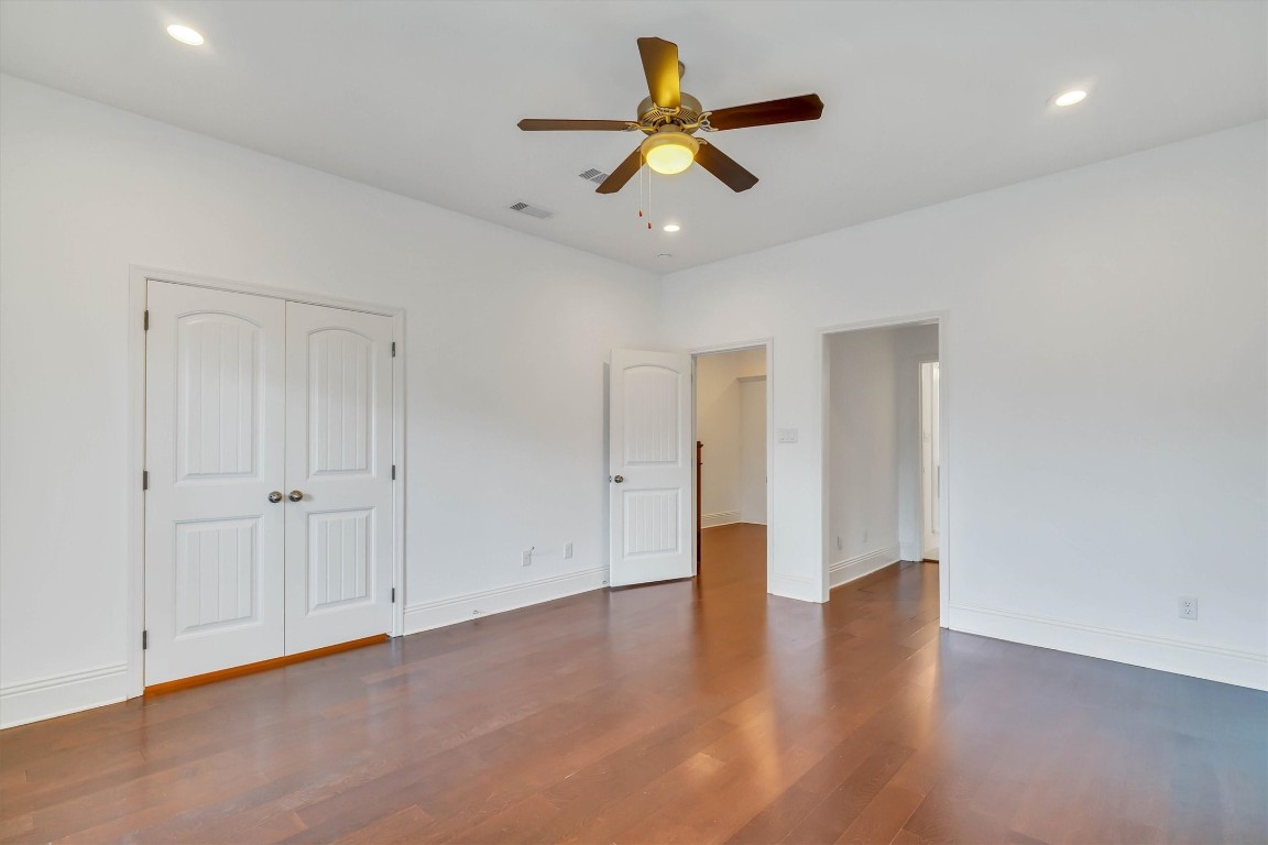 2405 Keene Street Houston, TX 77009 - Photo 16 of 45 a view of an empty room with window and wooden floor