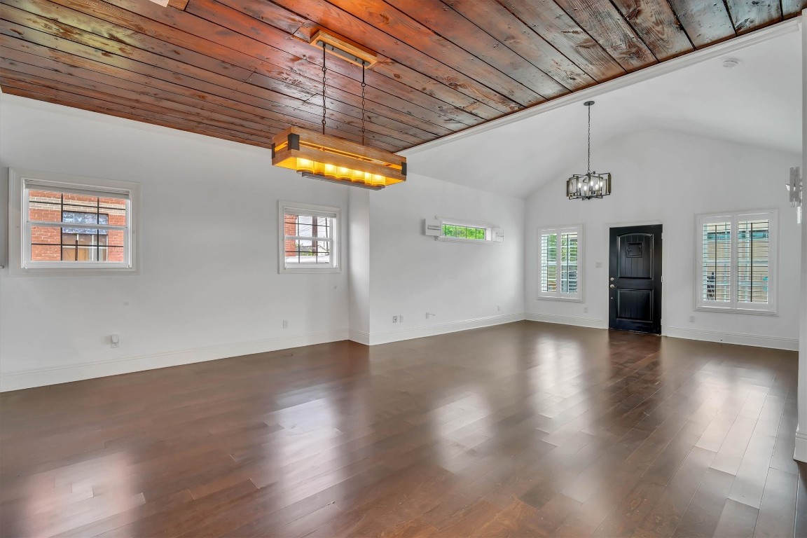 2405 Keene Street Houston, TX 77009 - Photo 2 of 45 a view of a hallway with wooden floors and a fireplace