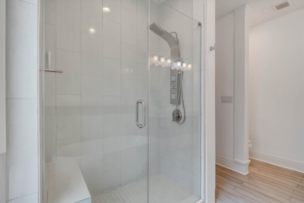 2405 Keene Street Houston, TX 77009 - Photo 22 of 45 a bathroom with a glass shower door