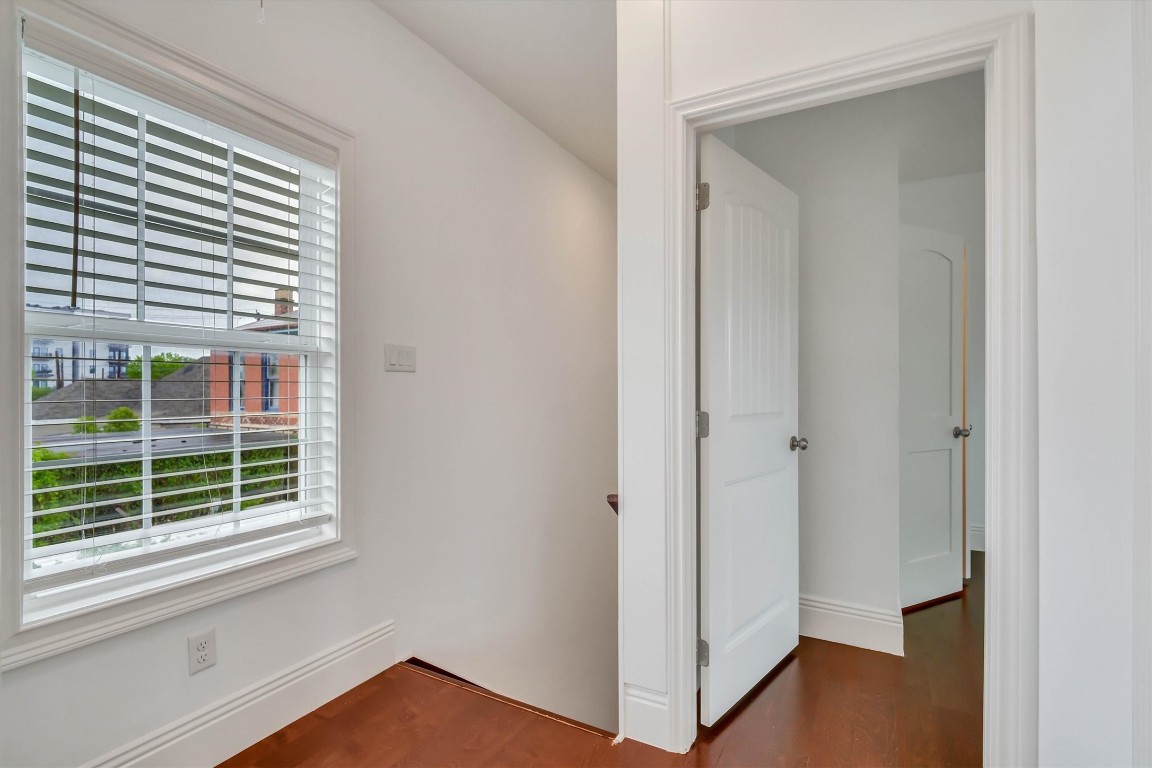 2405 Keene Street Houston, TX 77009 - Photo 30 of 45 a view of an empty room with wooden floor and a window