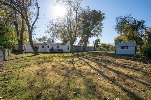 a view of a yard with trees