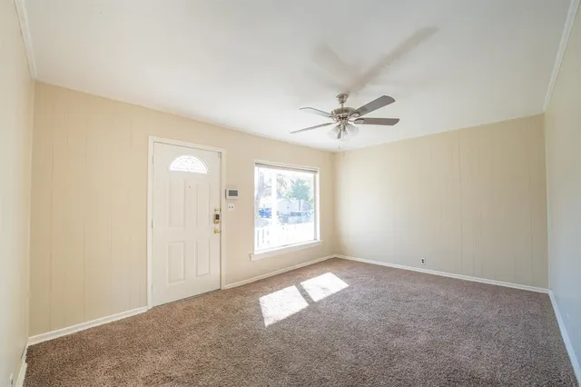 an empty room with windows and closet