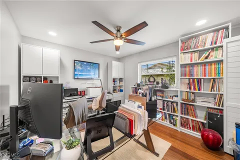 a living room with furniture a bookshelf and a bookshelf
