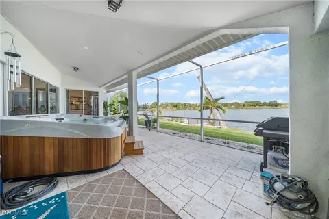 a view of a living room and floor to ceiling window or hardwood