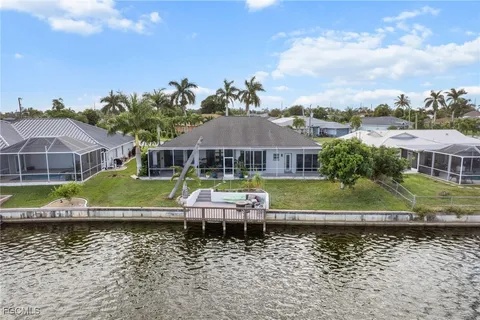 a aerial view of a house with a yard